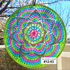 Colorful beaded sun catcher with a spiral pattern against a natural background
