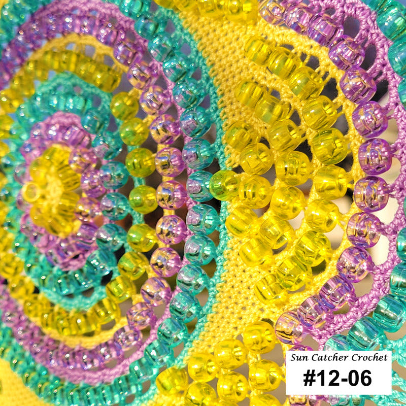 Close-up of colorful beaded sun catcher crochet item with 'Sun Catcher Crochet' label.