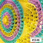 Close-up of colorful beaded sun catcher crochet item with 'Sun Catcher Crochet' label.