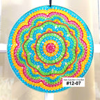 Colorful circular sun catcher with a white background
