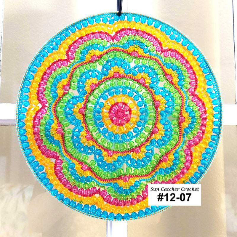 Colorful circular sun catcher with a white background