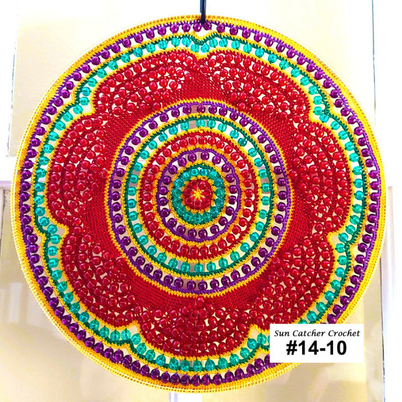 Colorful circular sun catcher with spiral pattern on a white background