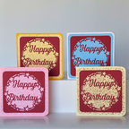 Four colorful 'Happy Birthday' greeting cards on a light gray background