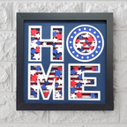Decorative wall art with 'HOME' letters in red, white, and blue on a gray brick background