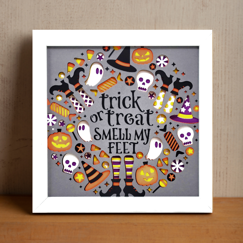 Halloween-themed framed artwork with text and icons on a gray background