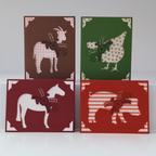 Four greeting cards with animal illustrations on a white background