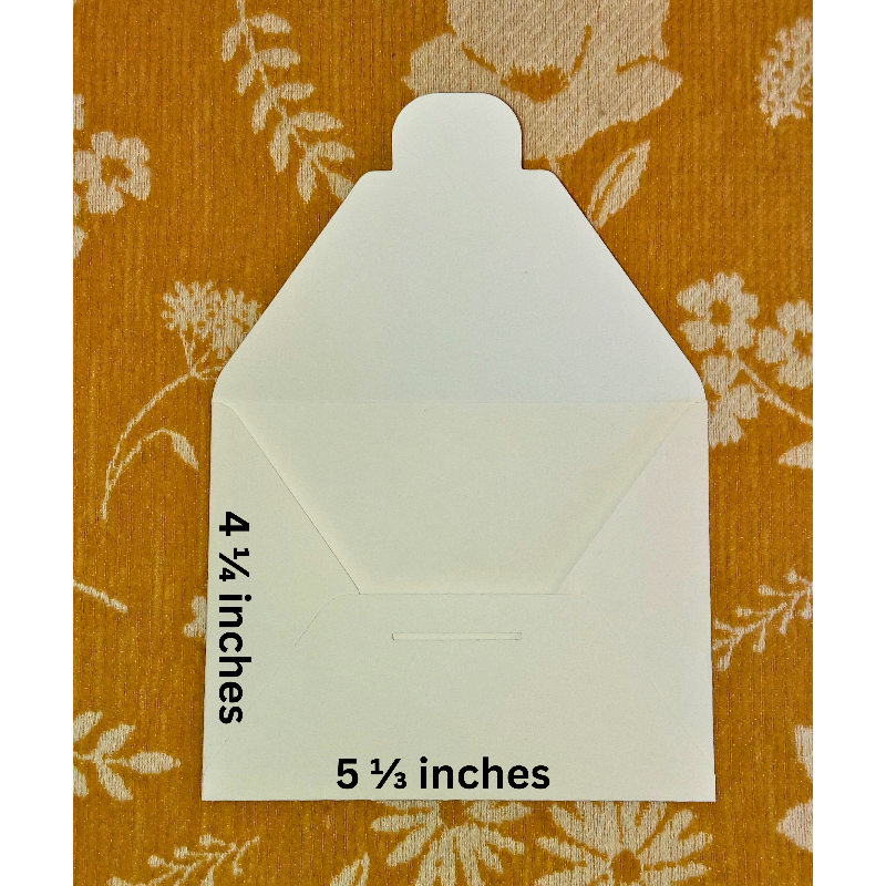 White envelope with measurements on a floral-patterned background