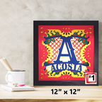 Decorative framed artwork with colorful design and 'ACOSIA' text on a wooden surface.
