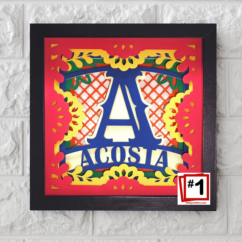 Decorative wall art with colorful letter 'A' and text on a white brick background