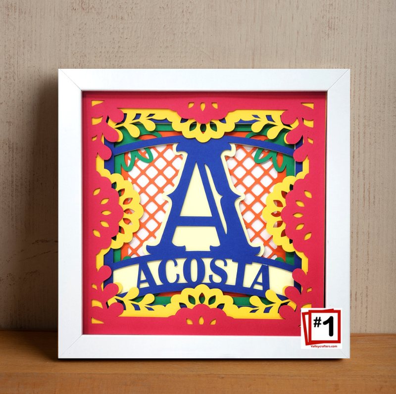 Decorative wall art with colorful letter 'A' and text 'ACOSTIA' in a white frame.