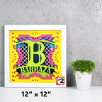 Framed colorful artwork with letter 'B' and text on a gray wall background