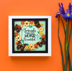 Decorative wall art with butterflies and flowers on an orange background