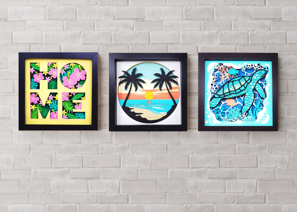 Three framed artworks on a gray brick wall.