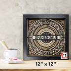 Decorative wall art with 'OFAHENGAUE' text on a wooden surface with stationery items.