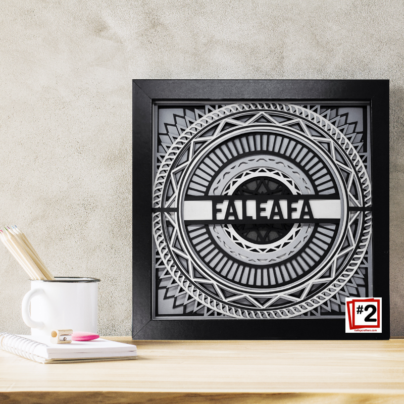 Decorative wall art with 'FALEAFA' design on a wooden surface.