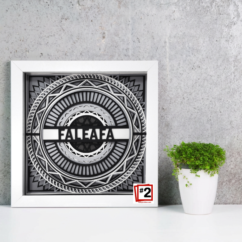 Framed black and white artwork with 'FALEFA' branding on a gray wall.