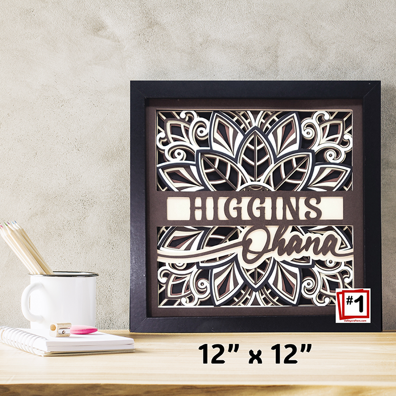 Decorative wall art with 'Higgins Ohana' text on a wooden surface.
