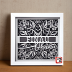 Decorative wall art with black cut-out design and 'Einau Ohana' text in a white frame.