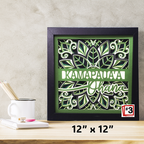 Decorative wall art with floral design and text on a wooden surface.