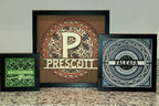 Three framed decorative prints with unique letter designs on a neutral background