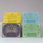 Four 'Happy Birthday Princess!' cards in yellow, blue, gray, and green with a crown design on a white background.