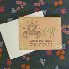 Birthday card for a princess with a horse and carriage illustration on a floral background