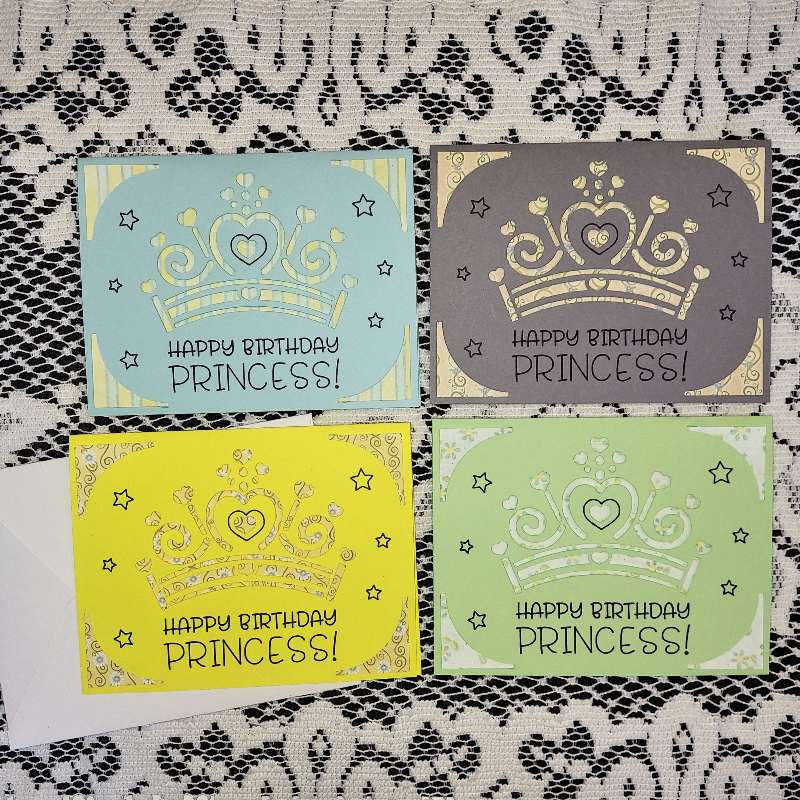 Four 'Happy Birthday Princess!' cards with crowns on a lace background