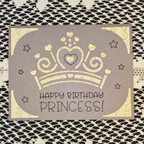 Greeting card with a gold crown design and 'Happy Birthday Princess!' text on a textured background.