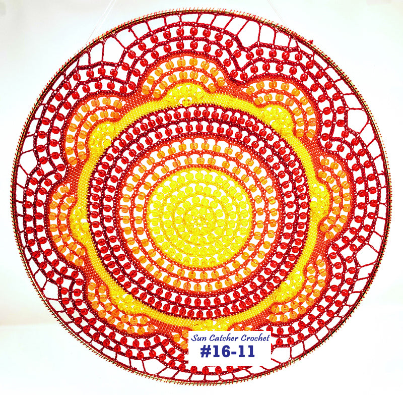 Circular crochet pattern with red and yellow colors on a white background