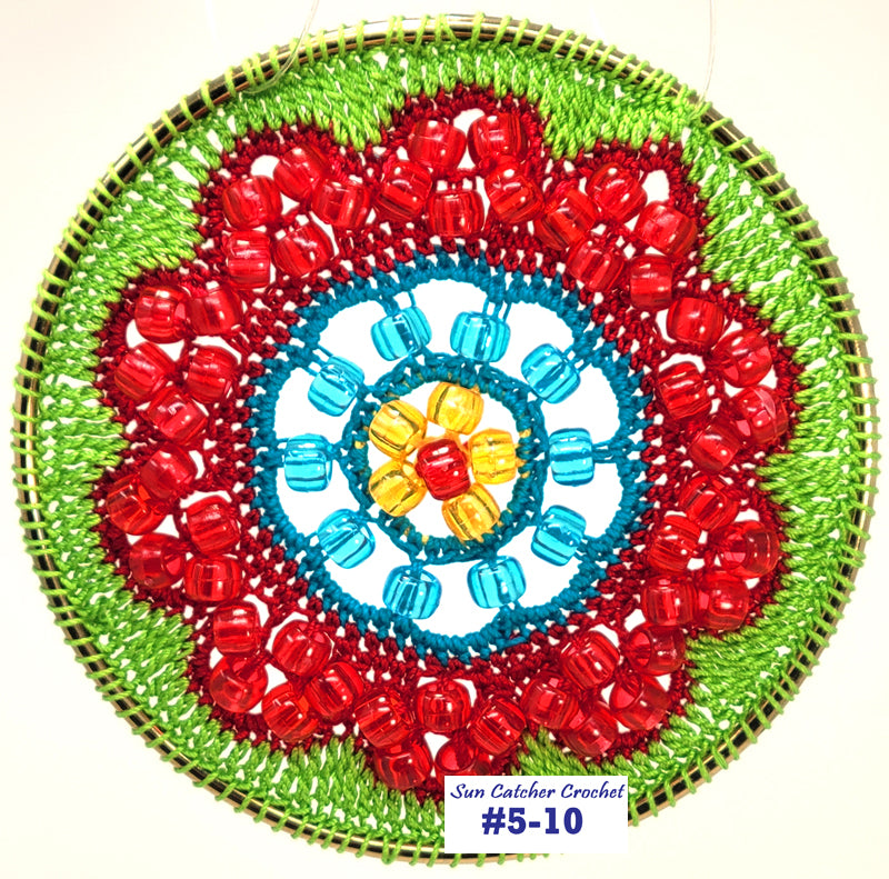 Circular crochet design with red, blue, and green colors on a white background
