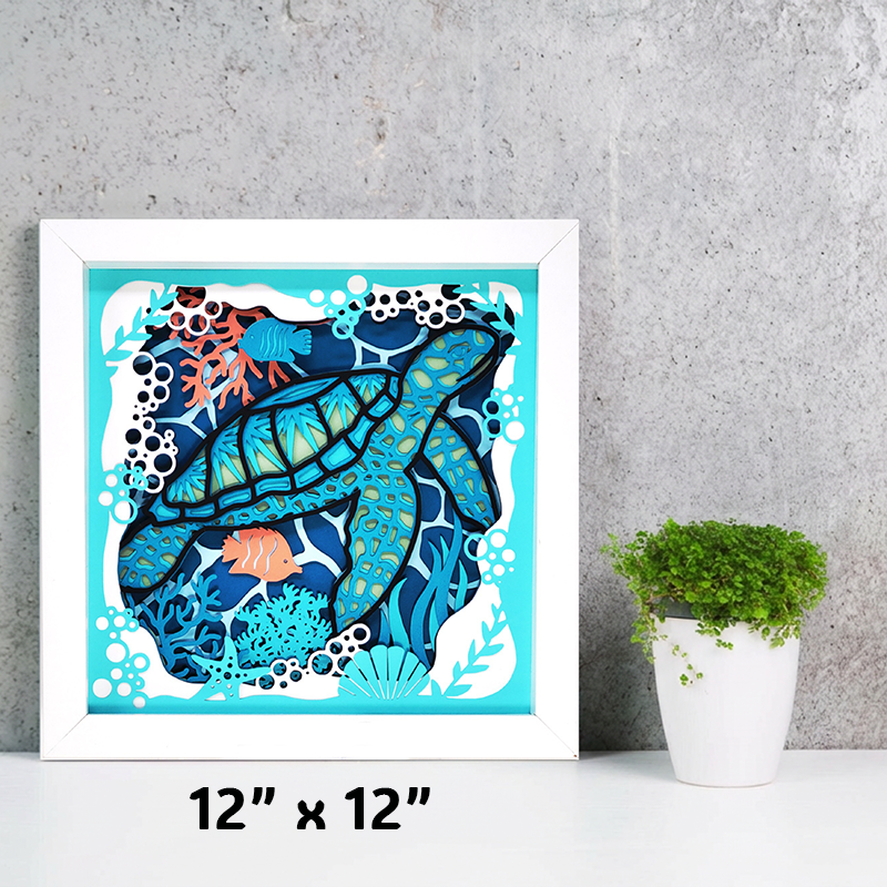 Framed artwork of a blue turtle with coral and fish on a gray wall.