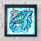 Framed artwork of a turtle and fish in an underwater scene on a textured wall.