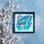 Framed artwork of a turtle with coral on a blue background with white decorative elements.