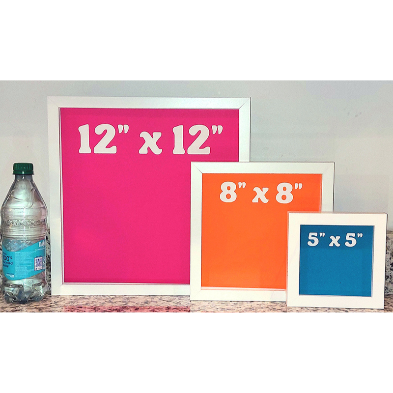 Three picture frames with different sizes displayed next to a water bottle.