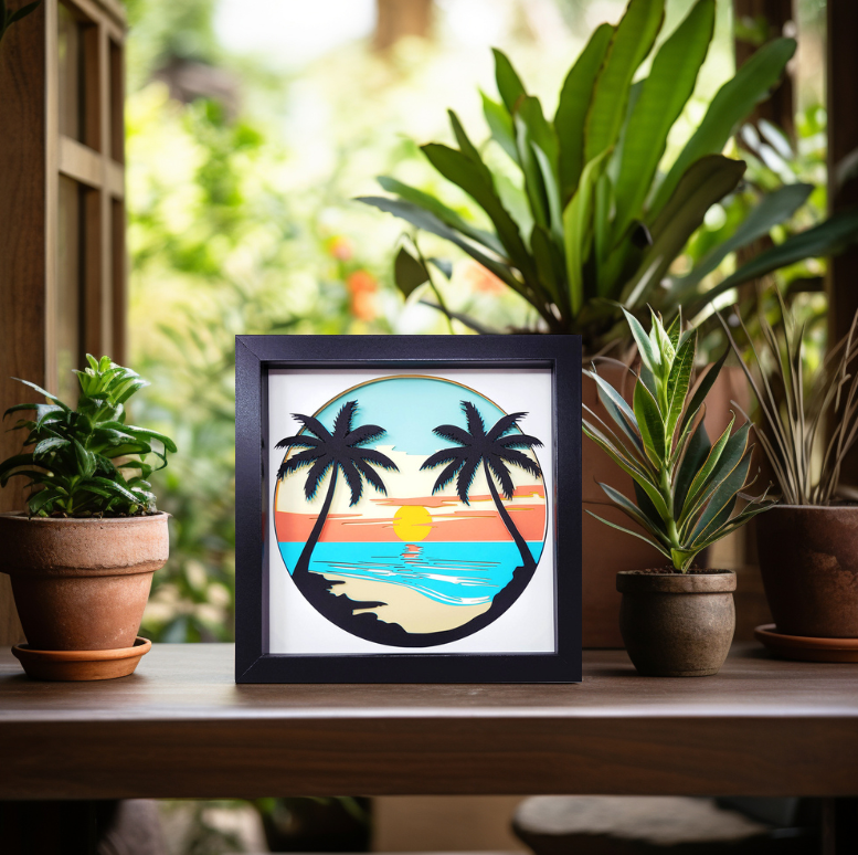 Framed artwork of palm trees and a sunset on a table with plants in the background