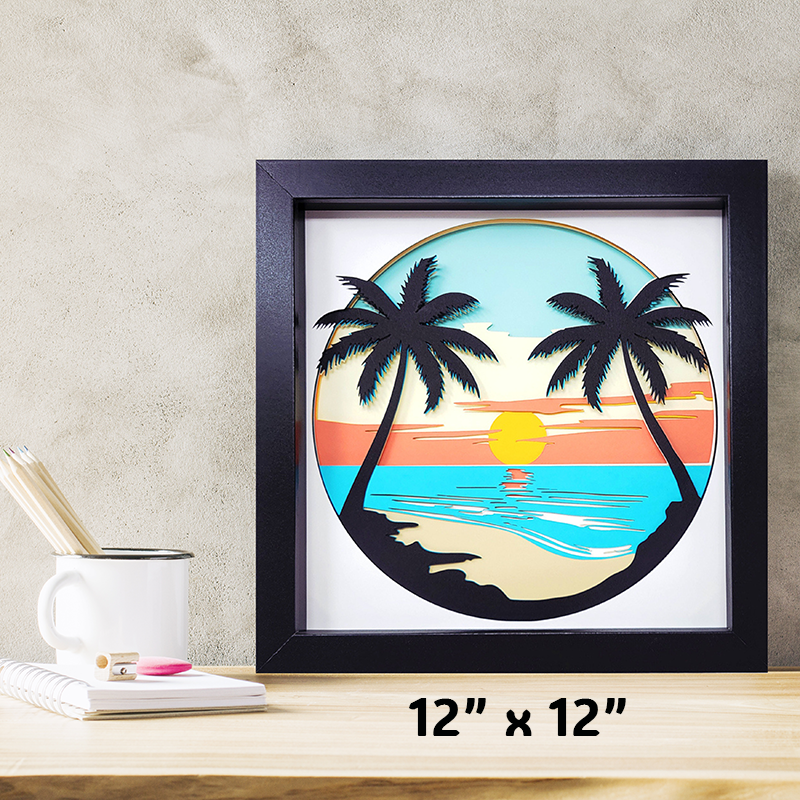 Framed artwork of a tropical sunset with palm trees on a wall.