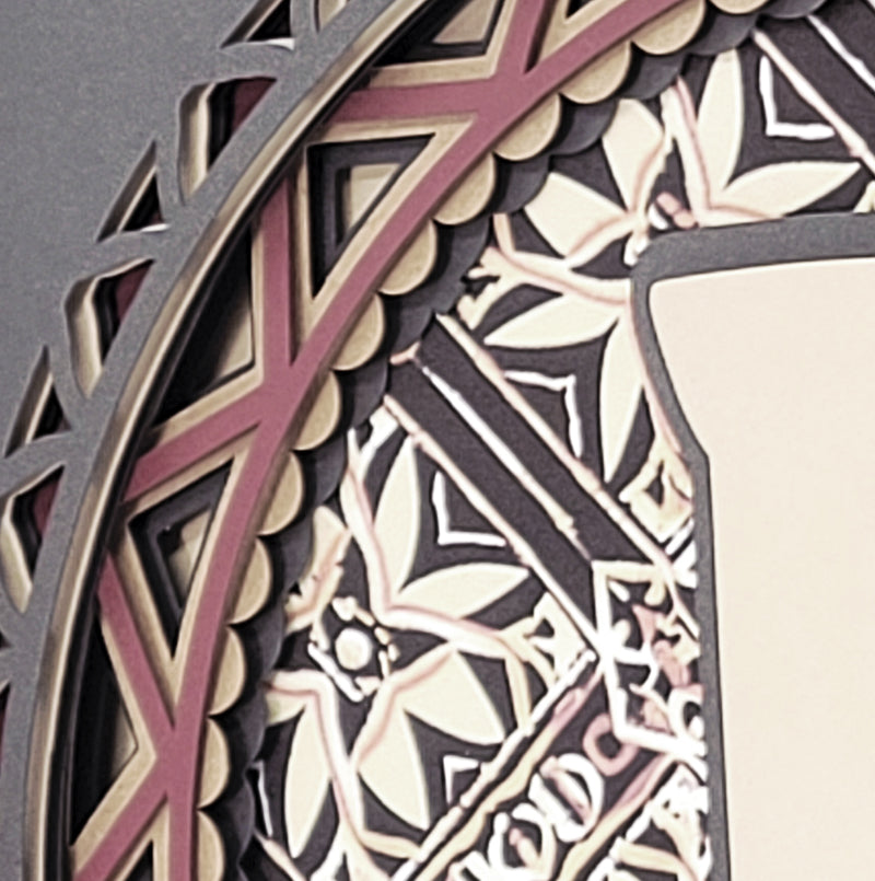Close-up of a decorative wall art piece with geometric patterns.