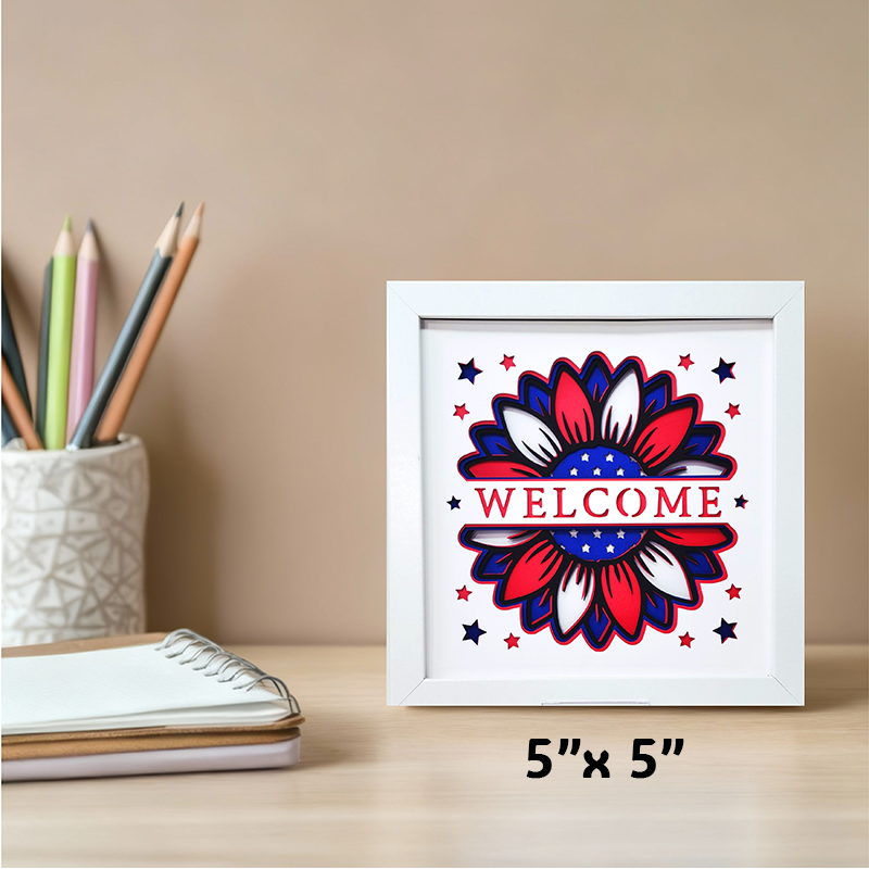 Framed artwork with a red, white, and blue design on a desk with stationery items.