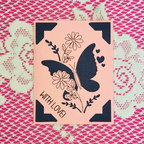 Card with butterfly and floral design on a pink background, featuring the text 'WITH LOVE!' on a patterned background.