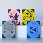Four decorative cards with butterfly and floral designs on a white background