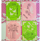 Four decorative cards with floral and jar designs on a patterned fabric background.
