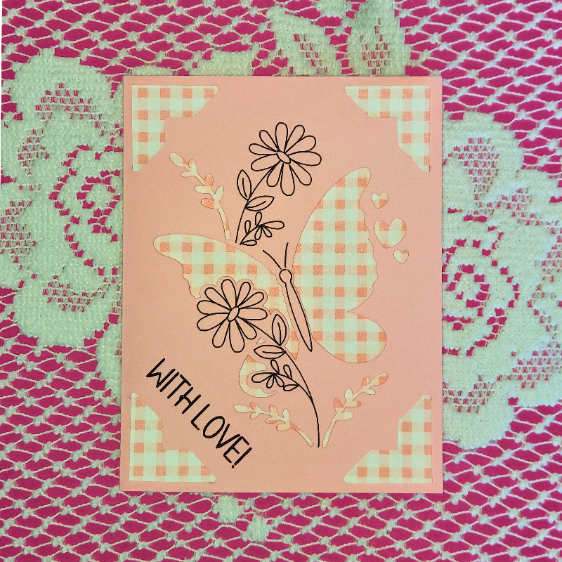 Card with butterfly and floral design on a patterned background