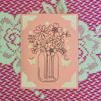 Illustration of flowers in a jar on a pink card with a decorative border.