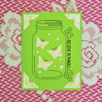 Green card with butterfly design and 'Believe in Magic' text on a patterned background