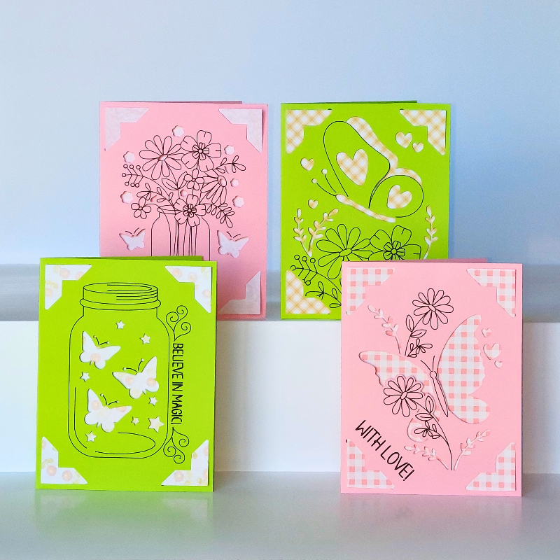 Four decorative greeting cards with floral and butterfly designs on a white background.