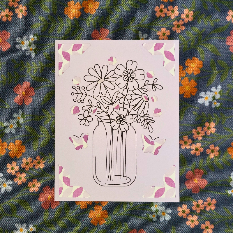 Floral design in a jar on a pink card with a floral patterned background