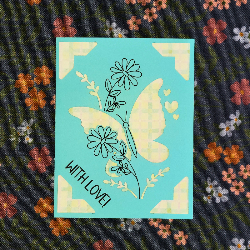 Card with butterfly design and 'With Love!' text on a floral background