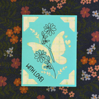 Card with butterfly design and 'With Love!' text on a floral background