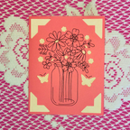 Card with floral design and butterflies on a patterned background