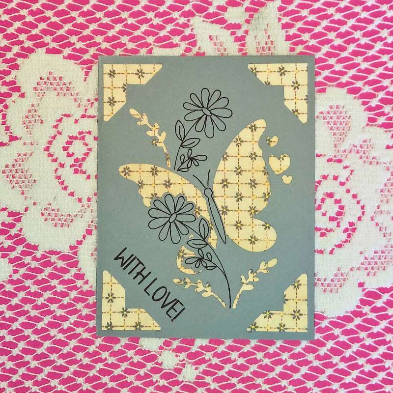 Card with butterfly design and 'With Love!' text on a patterned background